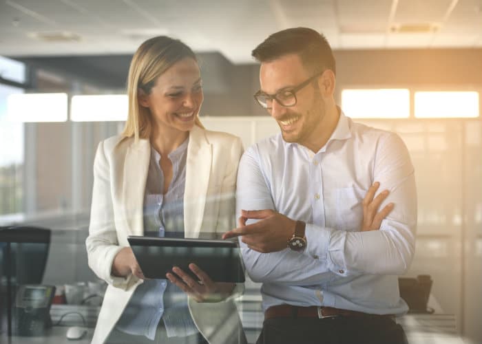 Corporate Employees Pointing to iPad
