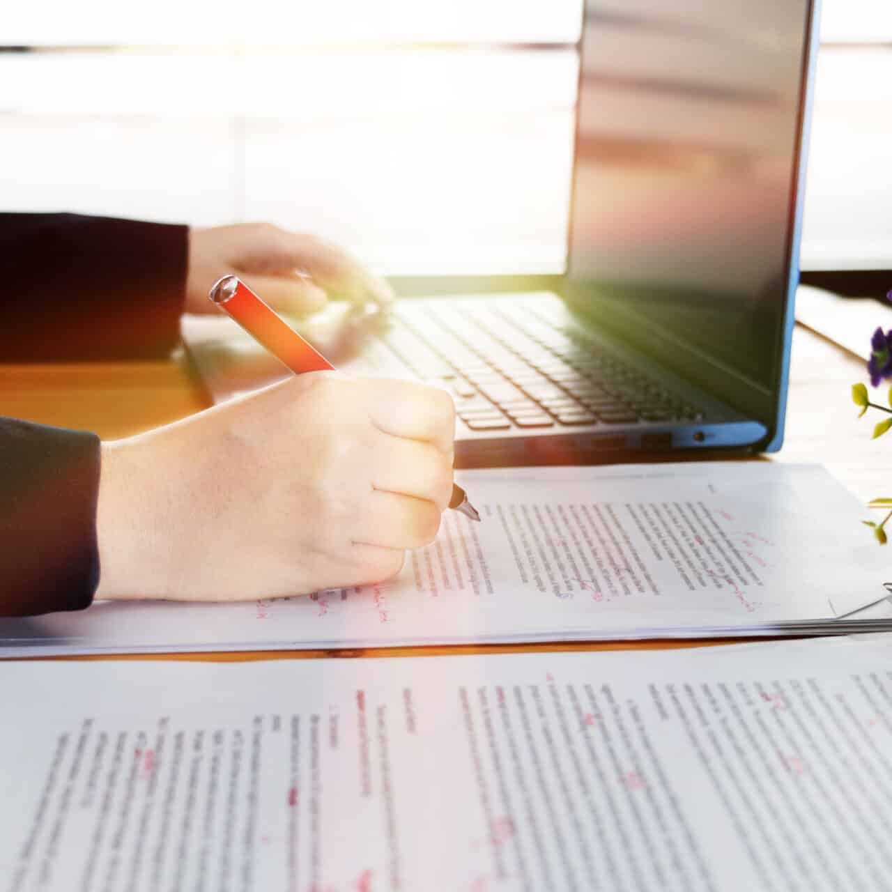 A closeup of Person Proofreading Essay