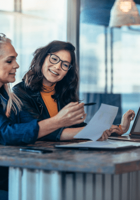 Ghostwriter and client collaborating in a successful relationship
